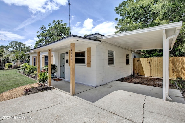 3904 Peach Dr, Jacksonville, FL 32246 - view of front of property with a carport