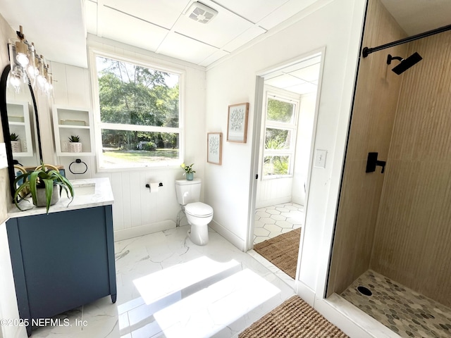 3904 Peach Dr, Jacksonville, FL 32246 - full bath with vanity, tiled shower, toilet, and marble finish floors
