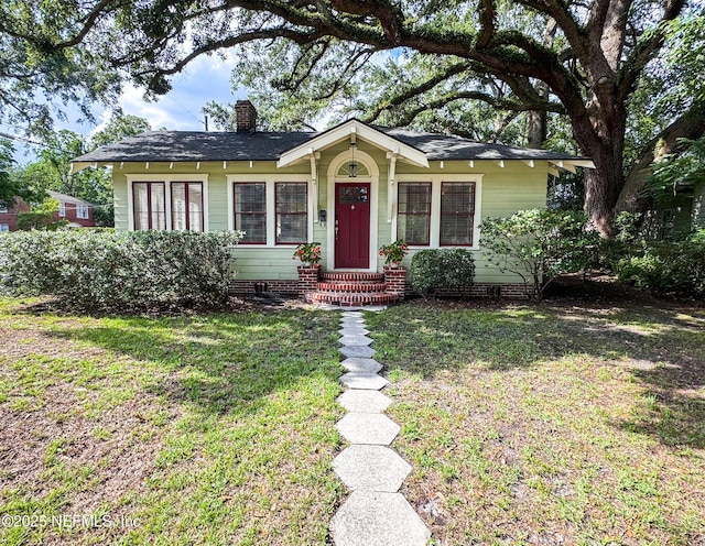2865 Forbes St, Jacksonville, FL 32205 - view of front of home featuring a front yard and a chimney