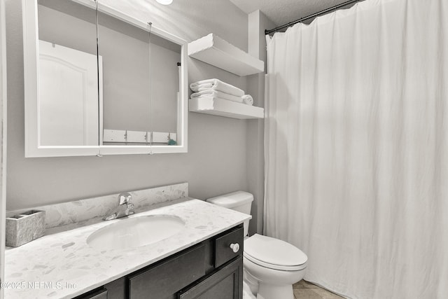 75 Codman Dr, Saint Augustine, FL 32084 - bathroom with toilet, vanity, and curtained shower