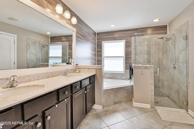 75 Codman Dr, Saint Augustine, FL 32084 - bathroom with a garden tub, a stall shower, double vanity, tile patterned floors, and recessed lighting