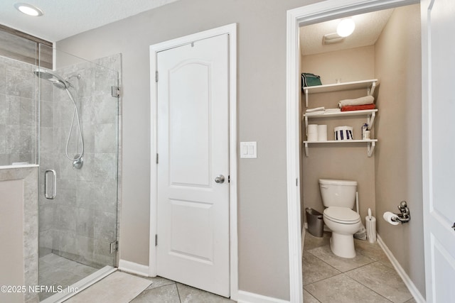 75 Codman Dr, Saint Augustine, FL 32084 - full bath with tile patterned flooring, a stall shower, toilet, and baseboards