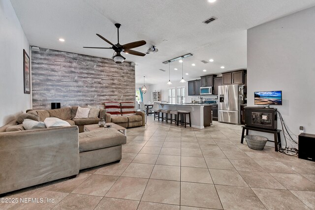 75 Codman Dr, Saint Augustine, FL 32084 - living room featuring ceiling fan, light tile patterned floors, a textured ceiling, and recessed lighting