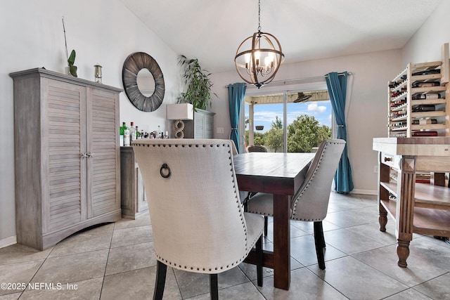 75 Codman Dr, Saint Augustine, FL 32084 - dining area with a chandelier, light tile patterned floors, and baseboards