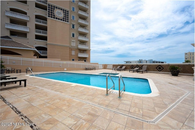 1201 1st St N Unit 1002, Jacksonville Beach, FL 32250 - community pool featuring a patio area