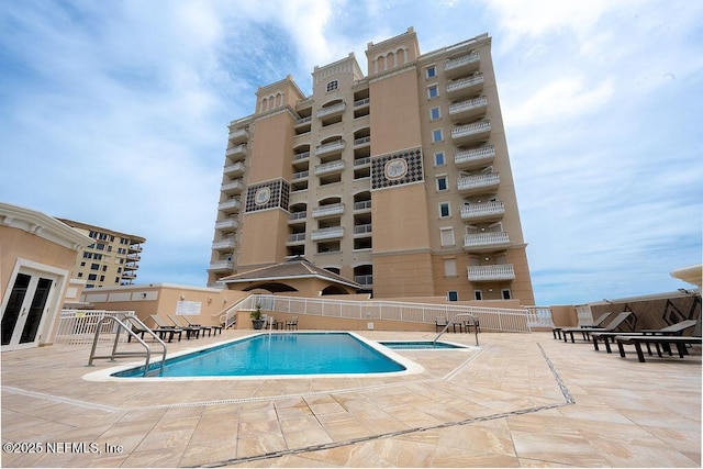 1201 1st St N Unit 1002, Jacksonville Beach, FL 32250 - community pool featuring a patio area and french doors