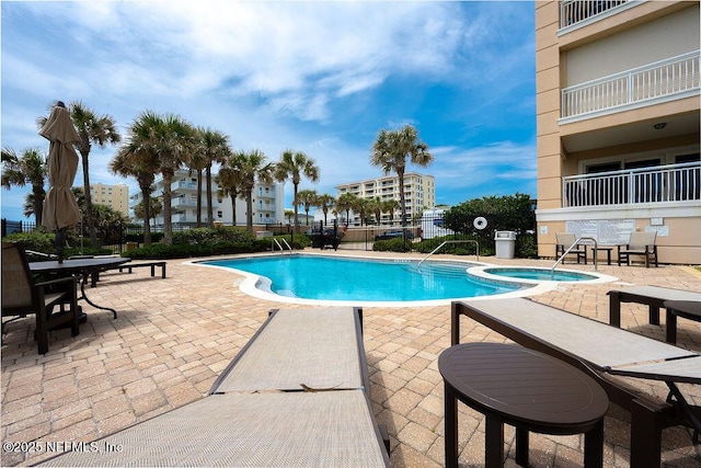 1201 1st St N Unit 1002, Jacksonville Beach, FL 32250 - community pool with a patio and a community hot tub