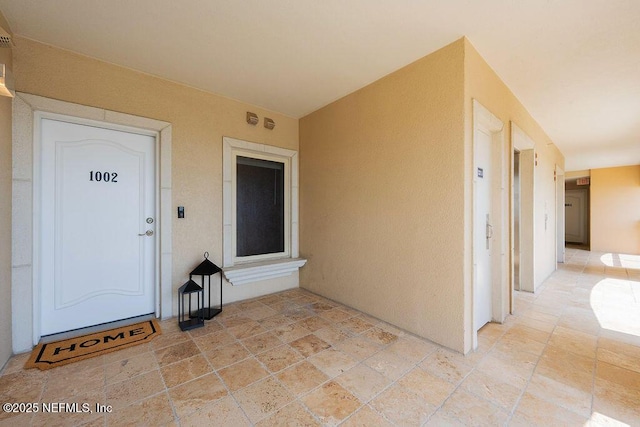 1201 1st St N Unit 1002, Jacksonville Beach, FL 32250 - view of exterior entry with stucco siding