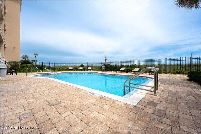 1201 1st St N Unit 1002, Jacksonville Beach, FL 32250 - community pool with a patio area