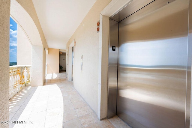 1201 1st St N Unit 1002, Jacksonville Beach, FL 32250 - corridor with elevator and arched walkways