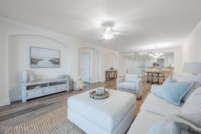 1201 1st St N Unit 1002, Jacksonville Beach, FL 32250 - living area with light wood-style floors, ornamental molding, arched walkways, baseboards, and a ceiling fan