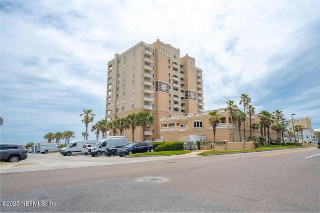 1201 1st St N Unit 1002, Jacksonville Beach, FL 32250 - view of building exterior featuring uncovered parking