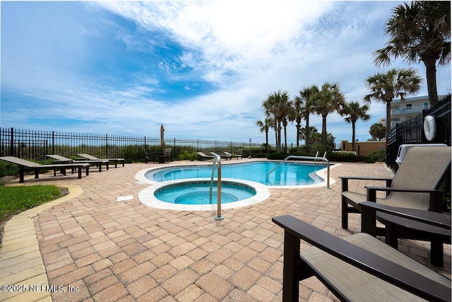 1201 1st St N Unit 1002, Jacksonville Beach, FL 32250 - community pool featuring a community hot tub and a patio area