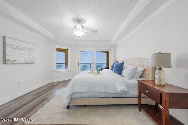 1201 1st St N Unit 1002, Jacksonville Beach, FL 32250 - bedroom with access to exterior, wood finished floors, ornamental molding, a textured ceiling, and ceiling fan