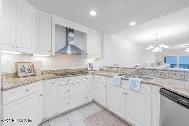 1201 1st St N Unit 1002, Jacksonville Beach, FL 32250 - kitchen with wall chimney range hood, stainless steel dishwasher, a sink, light tile patterned floors, and white cabinets