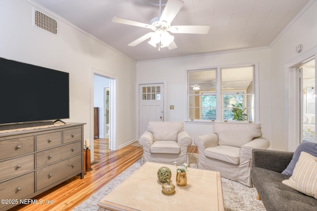 1643 Fishweir Creek Ln, Jacksonville, FL 32205 - living area with ornamental molding, light wood-type flooring, and ceiling fan
