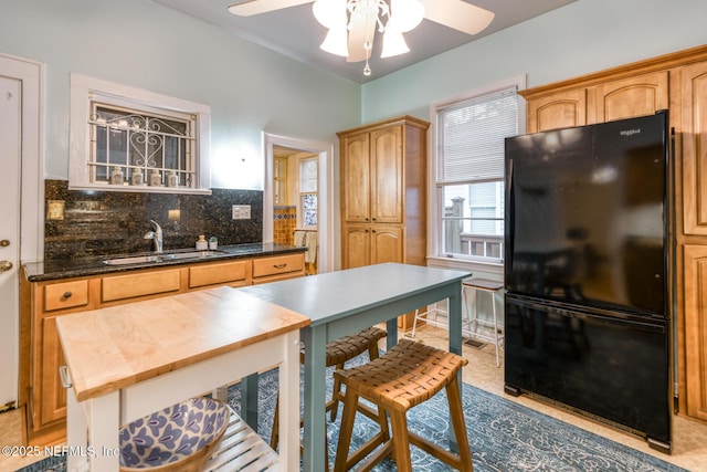 1643 Fishweir Creek Ln, Jacksonville, FL 32205 - kitchen featuring freestanding refrigerator, a sink, a ceiling fan, butcher block countertops, and backsplash