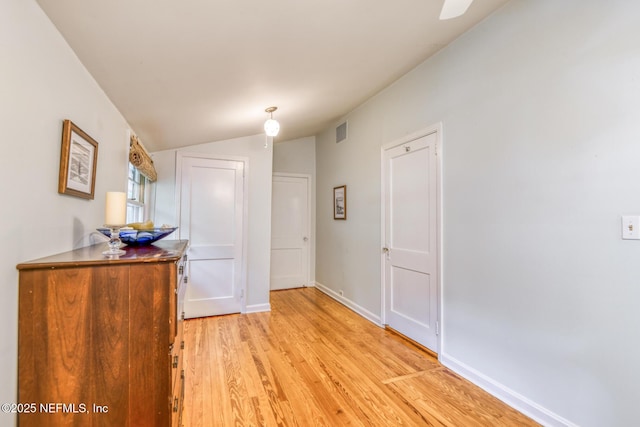 1643 Fishweir Creek Ln, Jacksonville, FL 32205 - corridor featuring light wood-type flooring, vaulted ceiling, and baseboards