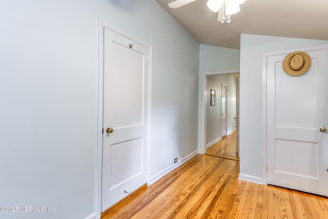 1643 Fishweir Creek Ln, Jacksonville, FL 32205 - unfurnished bedroom featuring light wood finished floors, baseboards, and vaulted ceiling
