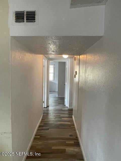 843 Line St, Jacksonville, FL 32209 - hallway featuring dark wood-style flooring and baseboards