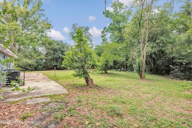 8390 Scottish Ct, Jacksonville, FL 32244 - view of grassy yard featuring a patio area