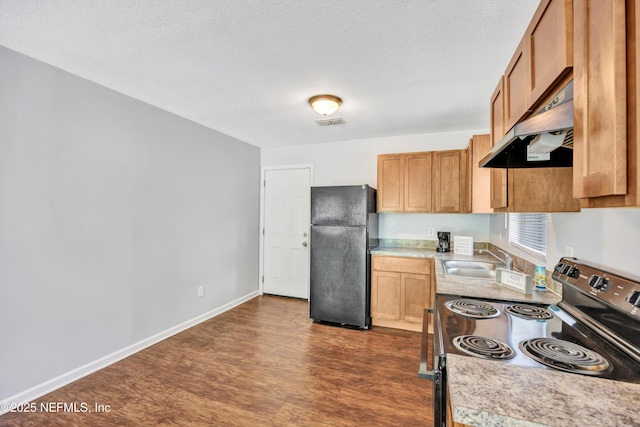 8390 Scottish Ct, Jacksonville, FL 32244 - kitchen with freestanding refrigerator, under cabinet range hood, electric range oven, a sink, and dark wood-style floors