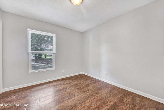 8390 Scottish Ct, Jacksonville, FL 32244 - empty room featuring wood finished floors and baseboards