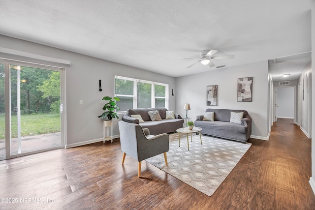 8390 Scottish Ct, Jacksonville, FL 32244 - living area with wood finished floors, a ceiling fan, and baseboards