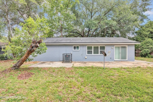 8390 Scottish Ct, Jacksonville, FL 32244 - rear view of property featuring a patio area, central AC unit, and a shingled roof