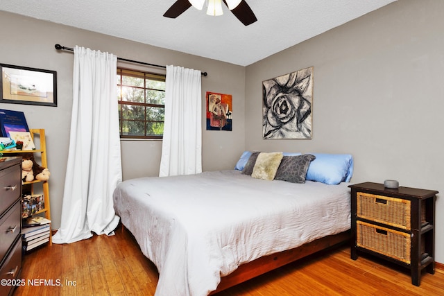 3111 Old Port Cir E, Jacksonville, FL 32216 - bedroom with wood finished floors and a ceiling fan