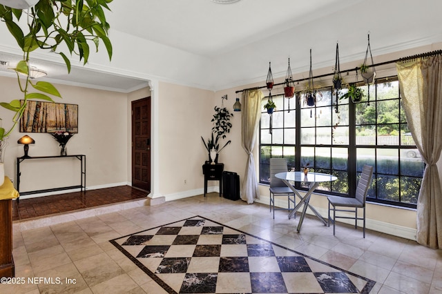 3111 Old Port Cir E, Jacksonville, FL 32216 - unfurnished dining area featuring tile patterned flooring, inlaid floor details, baseboards, and ornamental molding