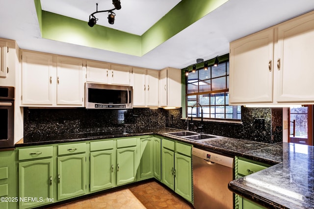 3111 Old Port Cir E, Jacksonville, FL 32216 - kitchen with stainless steel appliances, a sink, green cabinets, and healthy amount of natural light