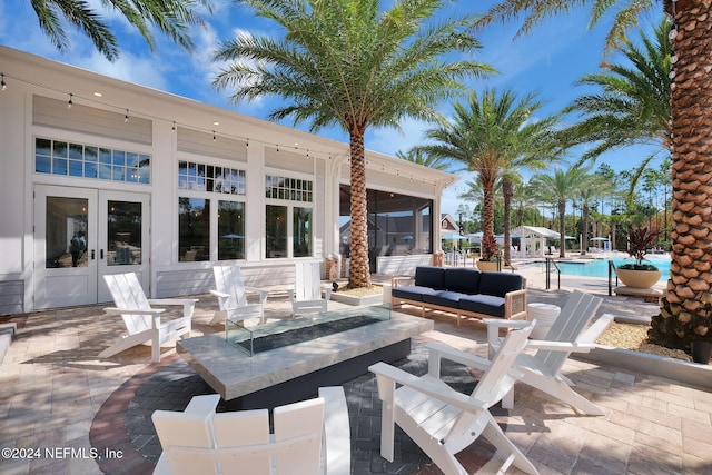 45 Lantern Post Way, Ponte Vedra, FL 32081 - view of patio / terrace with french doors, an outdoor pool, and an outdoor living space with a fire pit