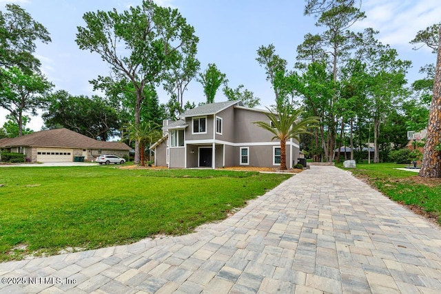 2605 Spreading Oaks Ln, Jacksonville, FL 32223 - view of front of house featuring a front yard, driveway, and a garage