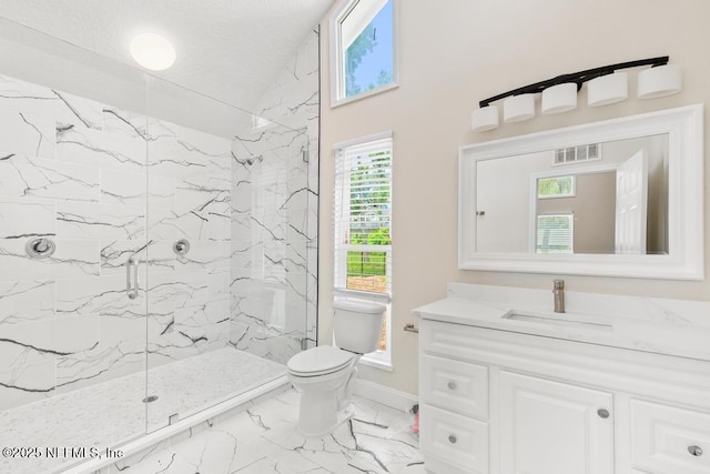 2605 Spreading Oaks Ln, Jacksonville, FL 32223 - full bathroom with marble finish flooring, toilet, vanity, a marble finish shower, and baseboards