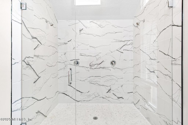 2605 Spreading Oaks Ln, Jacksonville, FL 32223 - bathroom featuring a marble finish shower