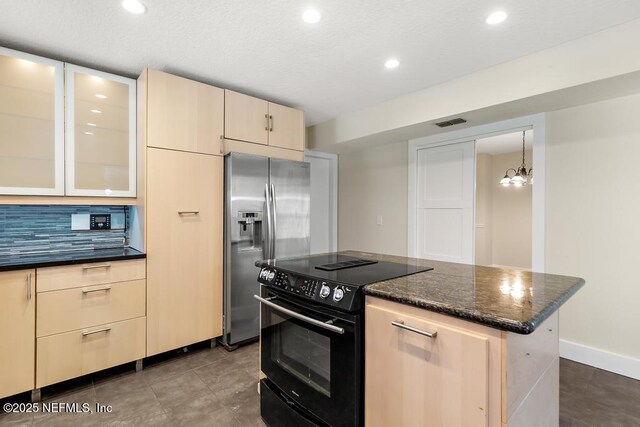 2605 Spreading Oaks Ln, Jacksonville, FL 32223 - kitchen with black / electric stove, stainless steel fridge with ice dispenser, recessed lighting, dark stone counters, and light brown cabinets