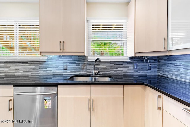2605 Spreading Oaks Ln, Jacksonville, FL 32223 - kitchen featuring stainless steel dishwasher, a sink, decorative backsplash, and dark stone counters