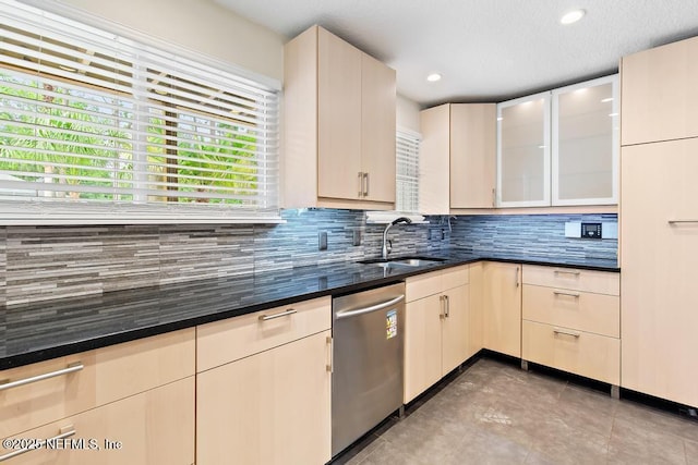 2605 Spreading Oaks Ln, Jacksonville, FL 32223 - kitchen featuring stainless steel dishwasher, a sink, tasteful backsplash, recessed lighting, and glass insert cabinets