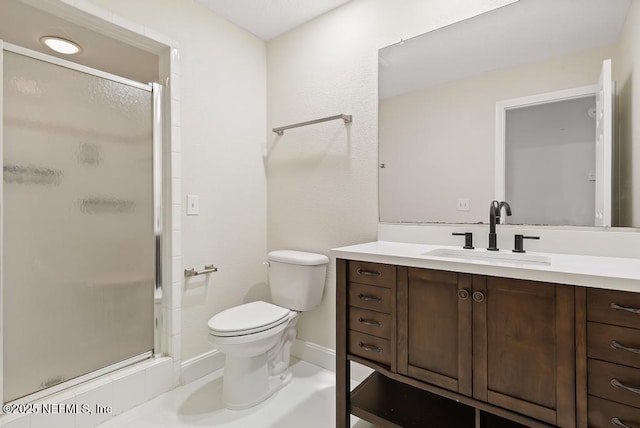 2605 Spreading Oaks Ln, Jacksonville, FL 32223 - full bathroom with vanity, a stall shower, toilet, and baseboards
