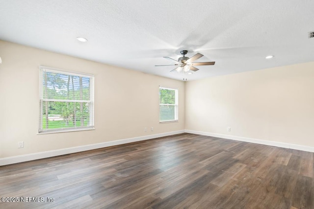 2605 Spreading Oaks Ln, Jacksonville, FL 32223 - empty room with a ceiling fan, dark wood-style flooring, baseboards, recessed lighting, and a textured ceiling