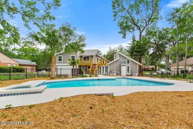 2605 Spreading Oaks Ln, Jacksonville, FL 32223 - view of swimming pool featuring an in-ground hot tub and a patio area