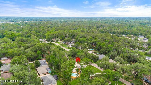 2605 Spreading Oaks Ln, Jacksonville, FL 32223 - aerial overview of property's location with a forest and nearby suburban area