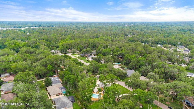 2605 Spreading Oaks Ln, Jacksonville, FL 32223 - aerial overview of property's location featuring a forest and nearby suburban area
