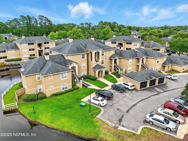 1655 The Greens Way Unit 2612, Jacksonville Beach, FL 32250 - aerial perspective of suburban area with a nearby body of water