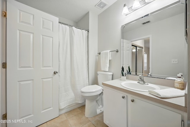 1655 The Greens Way Unit 2612, Jacksonville Beach, FL 32250 - bathroom featuring tile patterned floors, vanity, toilet, and a shower with curtain