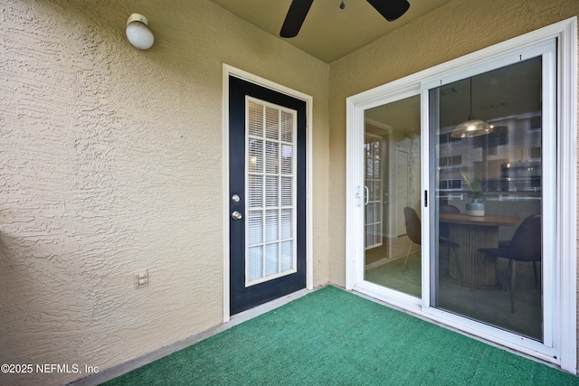 1655 The Greens Way Unit 2612, Jacksonville Beach, FL 32250 - property entrance featuring ceiling fan and stucco siding