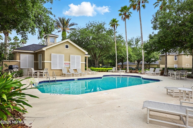 1655 The Greens Way Unit 2612, Jacksonville Beach, FL 32250 - community pool with a patio area and area for grilling