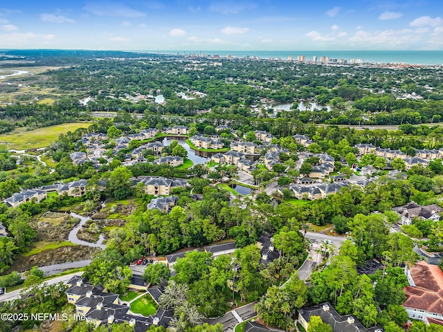 1655 The Greens Way Unit 2612, Jacksonville Beach, FL 32250 - aerial perspective of suburban area with a nearby body of water and a tree filled landscape