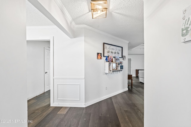 918 Arkenstone Dr, Jacksonville, FL 32225 - hallway featuring crown molding, a textured ceiling, wood finished floors, and baseboards